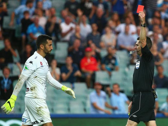 Paul Izzo of the Mariners receives a red card from referee Ben Williams.