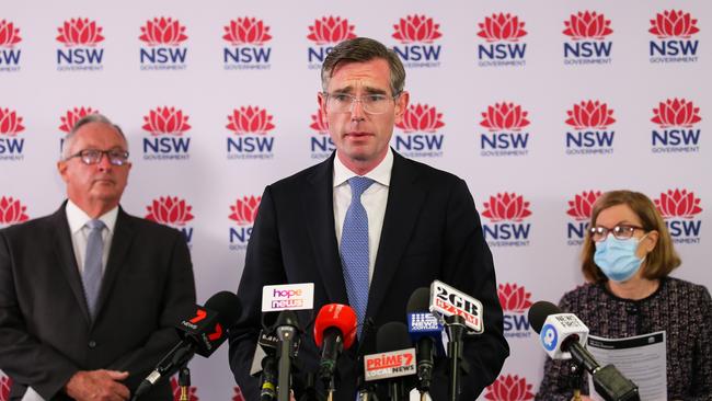 Premier Dominic Perrottet with Health Minister Brad Hazzard and Dr Kerry Chant on Tuesday. Picture: NCA Newswire / Gaye Gerard