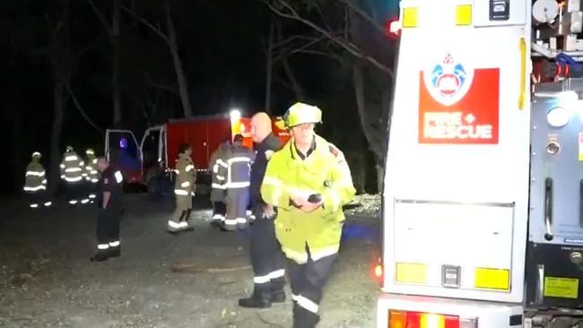 Emergency crews searching bushland after the crash. Picture: 9News