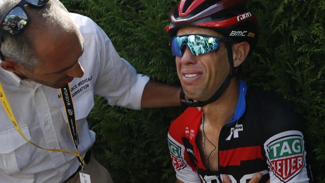 Australia's Richie Porte receives medical assistance after his fall forced him to quit the race for the second year in a row. Picture: AP