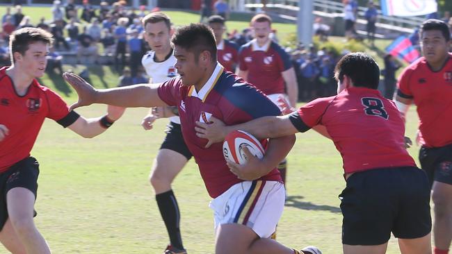 GPS Rugby: Gregory Terrace v Brisbane State High Jaiden Christian pushes aside Terrace defenders Saturday 10th August 2019. (AAP Image - Richard Waugh)