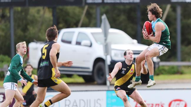 Geelong Amateur's Oscar Brownless takes a mark against Torquay. Picture: Alan Barber