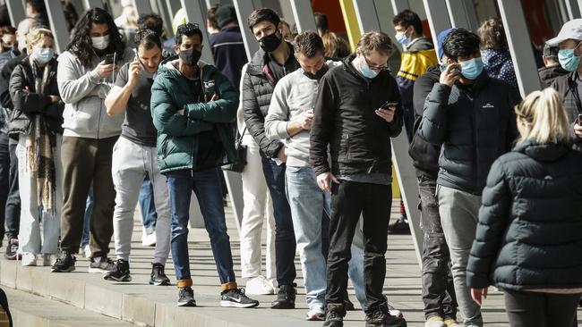 People line up outside the Melbourne Exhibition Centre vaccine hub on Wednesday. Picture: Getty Images