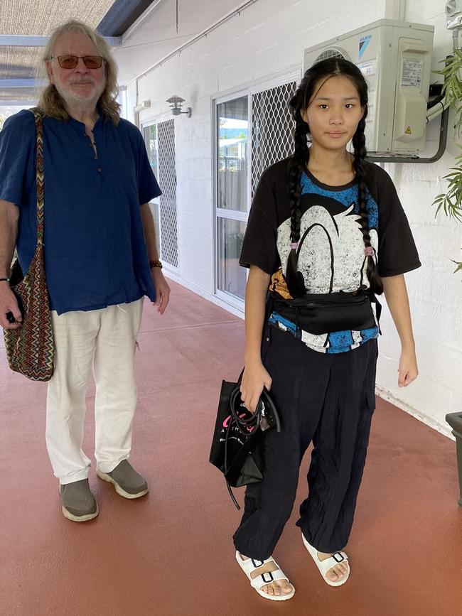 Melody Neal, 18, with her dad Stuart Neal, returning home for the first time from hospital. She was allegedly stabbed at school in May at Peace Lutheran College.