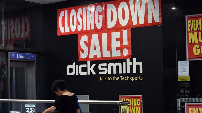 A woman enters a Dick Smith store during a closing down sale in the central business district of Sydney on April 21, 2016. The Reserve Bank has slashed rates by 275 basis points since November 2011 to boost the economy, but it has been almost a year since its last cut in May 2015. / AFP PHOTO / SAEED KHAN