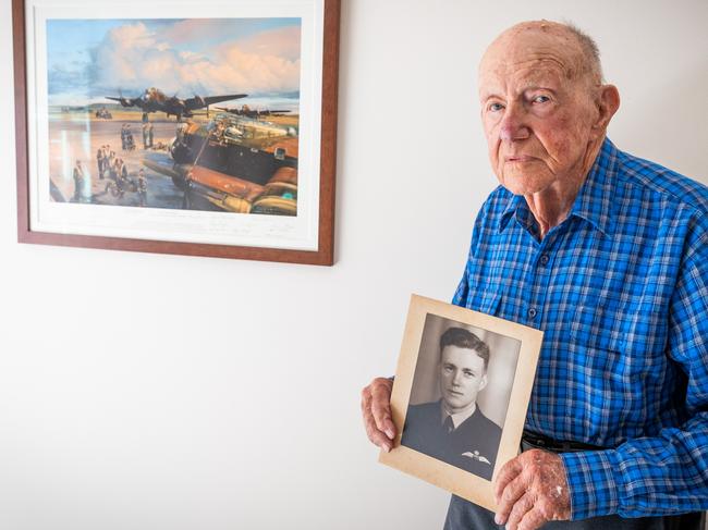 Bill Purdy 101-year-old veteran at his home in Mosman, Sydney with a photo of himself from 1944. Picture: Renee Nowytarger/TWAM