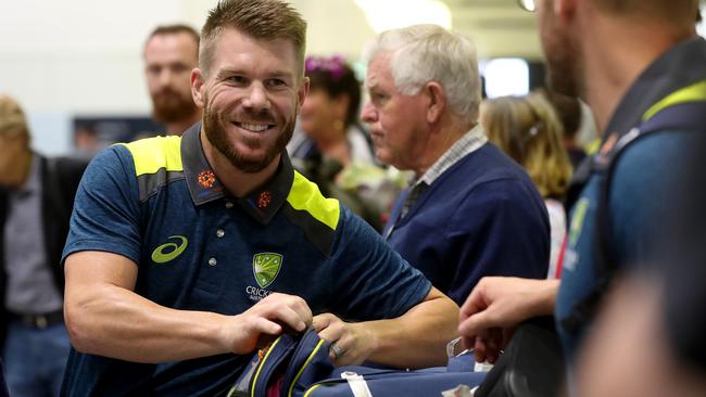 David Warner was all smiles touching down at Brisbane Domestic Airport. Picture: Tara Croser.