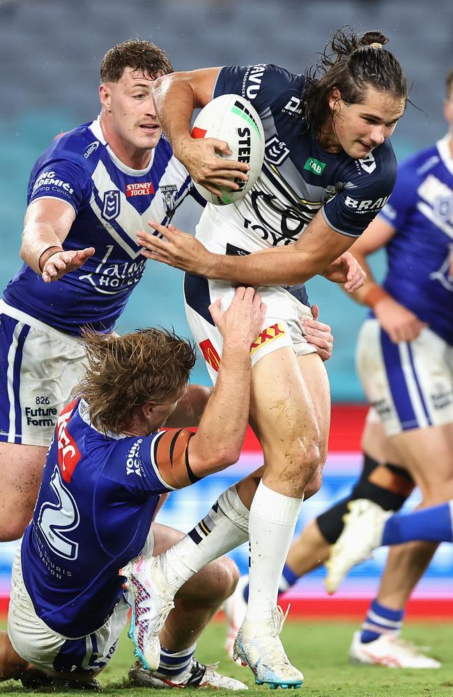 Tom Chester is tackled in the Cowboys’ match against the Canterbury-Bankstown Bulldogs (Photo by Cameron Spencer/Getty Images)