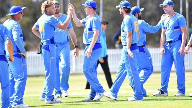 Norths players celebrate a wicket First grade cricket between Wynnum Manly and Norths. Saturday September 23, 2023. Picture, John Gass