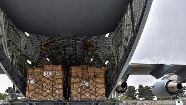 The first aid shipment in 10 months from Qatar is unloaded in Kabul on Tuesday. Picture: AFP