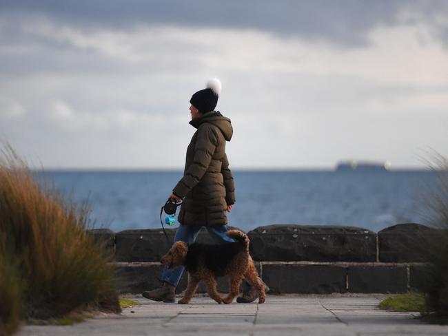 Cold weather in Melbourne. Trying to keep warm at Kerferd Road Pier, Albert Park. Picture: Josie Hayden