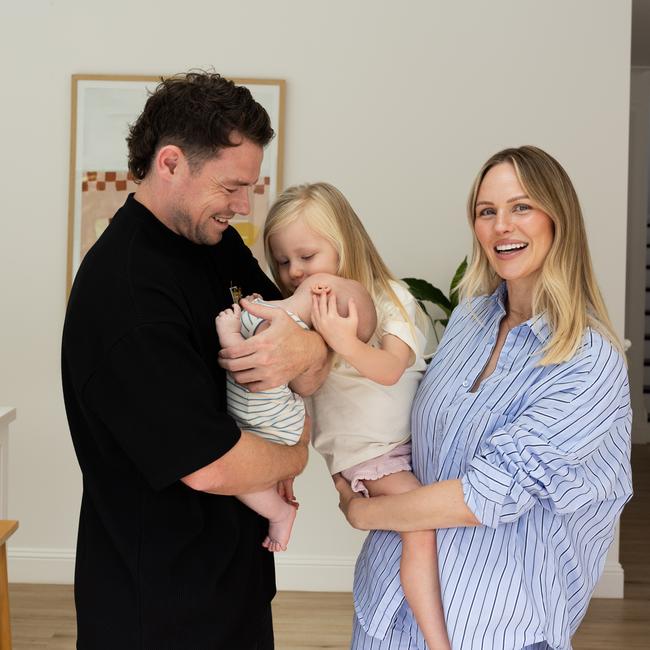 Lachie Neale pictured at home with his wife Jules and kids, Piper and baby Freddie. Photograph David Kelly