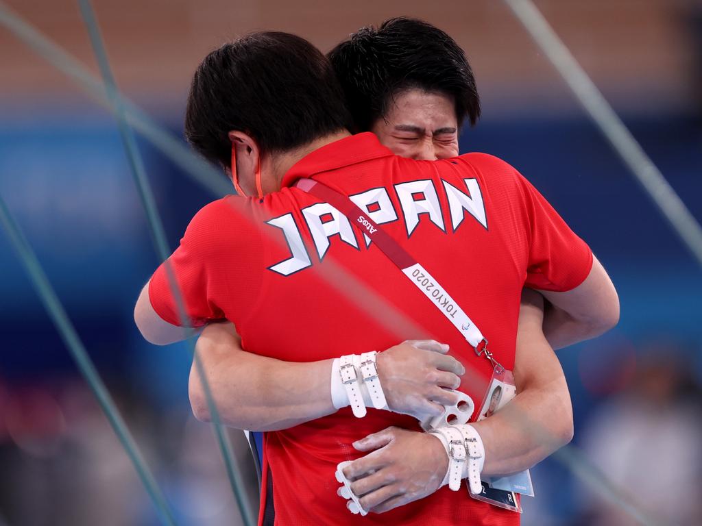 Hashimoto celebrates winning gold with his coach Picture: Jamie Squire/Getty Images