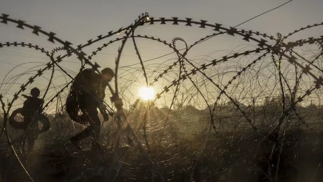 Ukrainian troops install antitank land mines along the front line in the Donetsk region of Ukraine. Picture: Ukrainian 24th Mechanised Brigade/AP