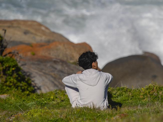 ADELAIDE, AUSTRALIA - NewsWire Photos - SEPTEMBER 03, 2024: Granite island teen missing after being swept off the rocks.Brother of the missing teen, Sahil Habibi in the white hoody waiting. Picture: NewsWire / Roy VanDerVegt