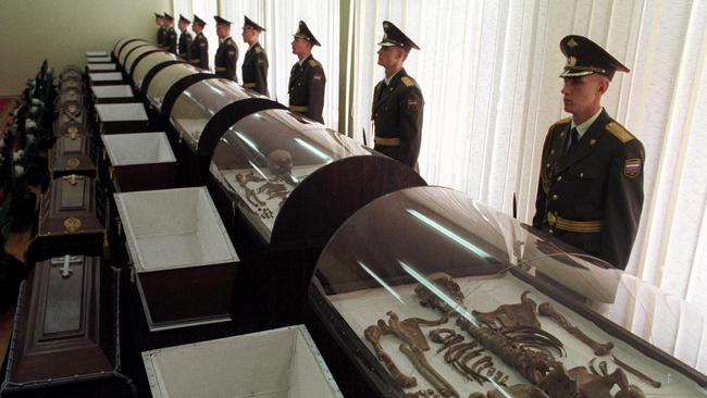 Soldiers guard near the remains of Nicholas II, his wife and three of their five children.