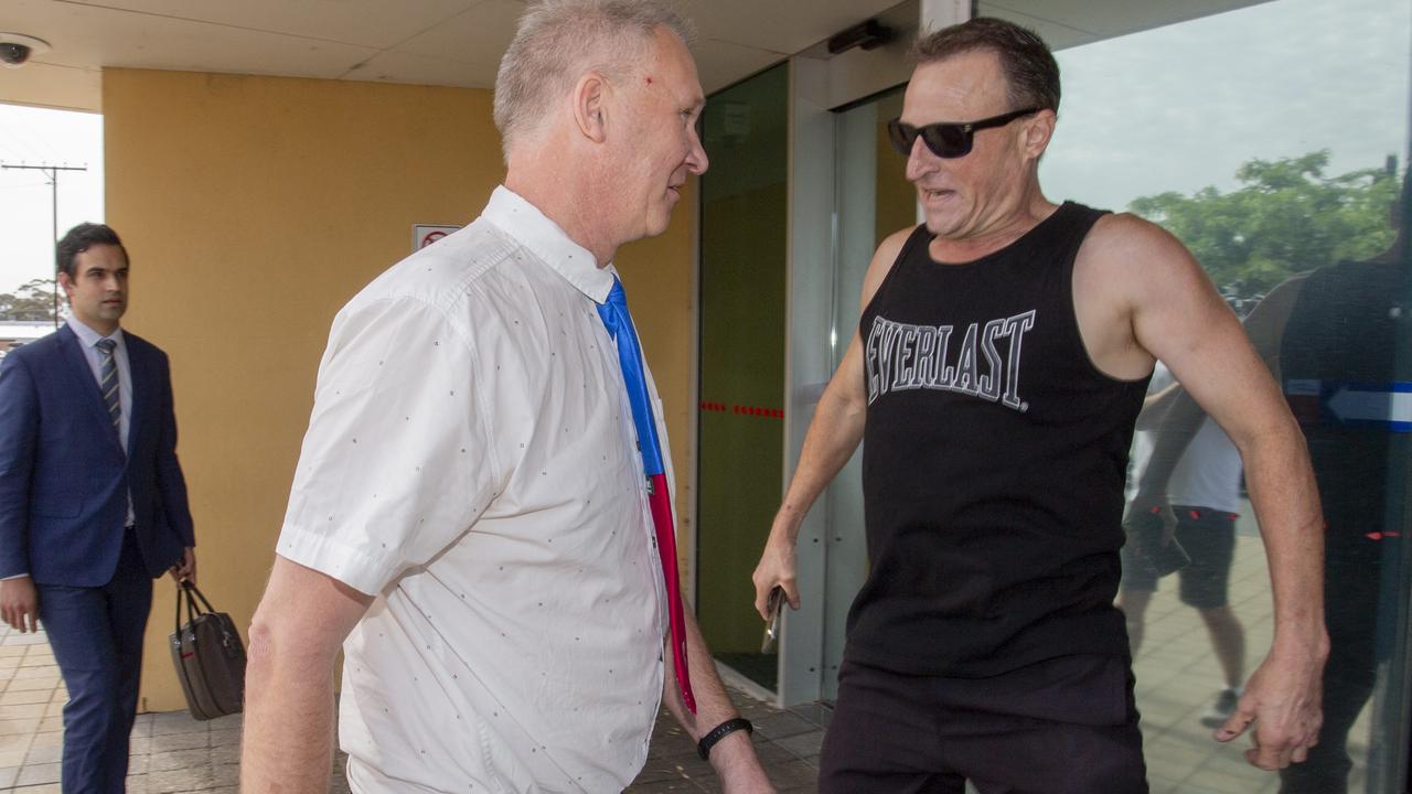 Former Onkaparinga councillor Robert de Jonge is confronted outside Christies Beach Magistrates Court. Picture: Brett Hartwig