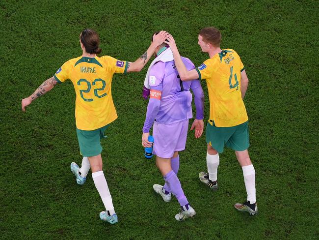 (L-R) Jackson Irvine and Kye Rowles console Mathew Ryan at the end of the match. Picture: Laurence Griffiths/Getty Images