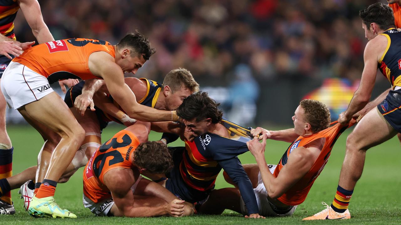 Tempers flare with Josh Rachele (centre) of the Crows and a number of Giants during the AFL Round 18 match at Adelaide Oval on July 15, 2023 in Adelaide, Australia. (Photo by Sarah Reed/AFL Photos via Getty Images)