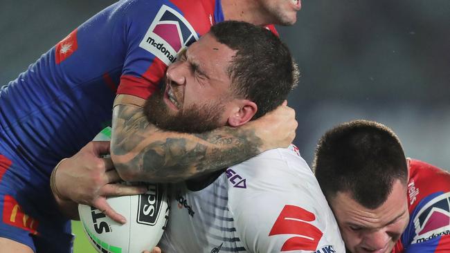 GOSFORD, AUSTRALIA - JUNE 13: Kenneath Bromwich of the Storm is tackled during the round five NRL match between the Newcastle Knights and the Melbourne Storm at Central Coast Stadium on June 13, 2020 in Gosford, Australia. (Photo by Matt King/Getty Images)