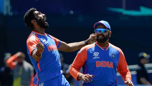 Jasprit Bumrah celebrates with teammate Rohit Sharma. Picture: Timothy A. Clary/AFP