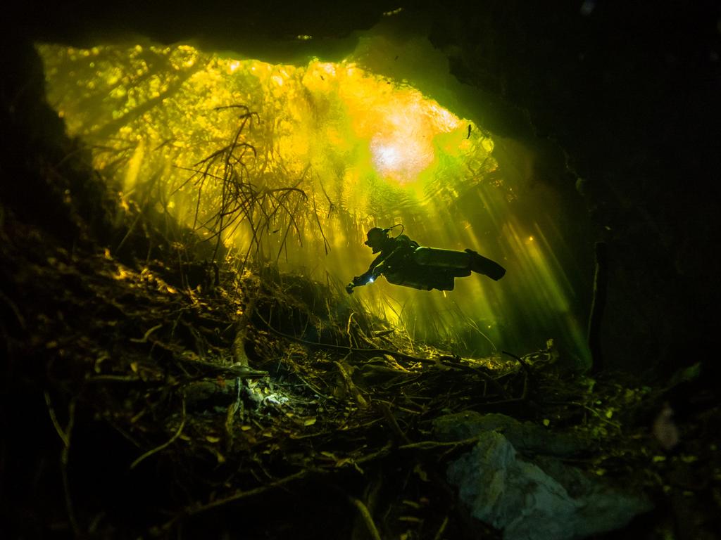 ‘Tajma-Ha’ ... This photograph was taken while I was scuba diving in Cenote Tajma-Ha, Yucatan, Mexico. The yellowish colour of the water is obtained from the high levels of tannic acid there. I’m a PADI instructor and a certified full cave diver. Picture: Joana Villar, Portugal, Entry, Open, Landscape and Nature, 2018 Sony World Photography Awards