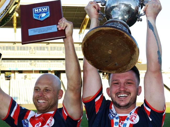 (L-R) Camden Rams skipper Brad Speechley and John Martin are all smiles after winning the Macarthur premiership. Picture Warren Gannon Photography