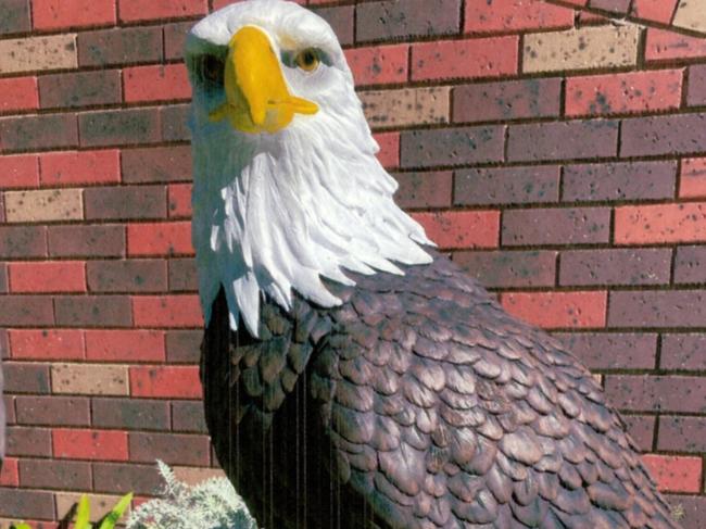 A Melbourne couple who have turned their property into local landmark with a fibreglass zoo full of with giraffes, elephants and tigers are hunting a 25kg bald eagle stolen from the front yard