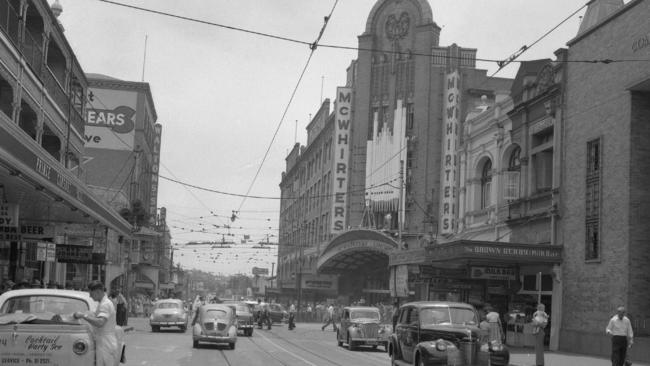 Traffic in Wickham Street, Fortitude Valley, in inner Brisbane. The McWhirters building, a major department store, is in the background. Picture: Cliff Potter/The Courier-Mail Photo Archive