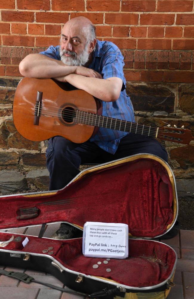 City busker Peter Gaetjens has set up a PayPal because fewer people carry coins. Picture: Tricia Watkinson