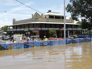 Aerial photos of Northern NSW Flooding. Grafton locals watch the floodwaters from behind the safety of the Levy which saved the town from flooding. Pic Glenn Hampson. Picture: HAMPSON GLENN