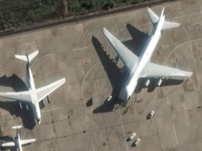 This handout satellite image released by Maxar Technologies on December 13, 2024 shows an Antonov An-124 heavy transport aircraft preparing to load equipment at the Russian Hmeimim Air Base in Syria's western province of Latakia. Islamist-led rebels took the Syrian capital Damascus in a lightning offensive on December 8, ousting president Bashar al-Assad and ending five decades of Baath rule in the country. Assad was propped up by Russia, where he reportedly fled, as well as Iran and Lebanon's Hezbollah militant group. (Photo by Satellite image Â©2024 Maxar Technologies / AFP) / RESTRICTED TO EDITORIAL USE - MANDATORY CREDIT "AFP PHOTO /  SATELLITE IMAGE Â©2024 MAXAR TECHNOLOGIES" - NO MARKETING NO ADVERTISING CAMPAIGNS - DISTRIBUTED AS A SERVICE TO CLIENTS