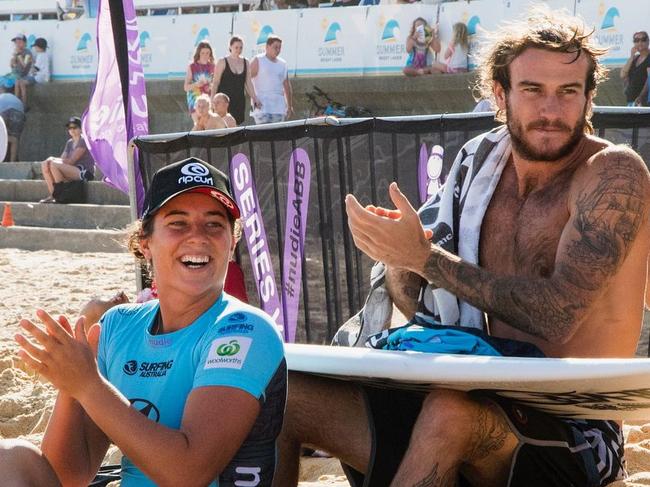 Tyler and Mikey Wright watch a surfing competition. Picture: Instagram