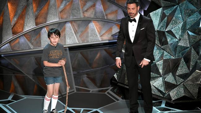 Jimmy Kimmel speaks onstage to a younger version of himself during an Oscars sketch. Picture: Getty