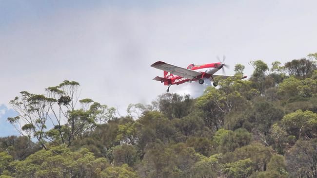 A water bomber over Gorge Road at Montacute in the Adelaide Hills in January 2023. Picture: Dean Martin