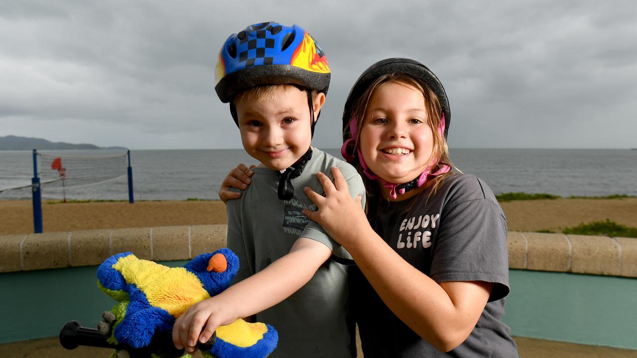 Carson. 5, and Ellie MacDonald, 9, enjoy a scooter ride along the Strand. Picture: Evan Morgan