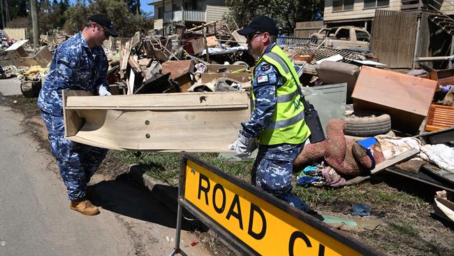 Members of the Australian Defence Force (ADF) help with the clean up of flood affected properties in Goodna, west of Brisbane. Picture: NCA NewsWire/Dan Peled.