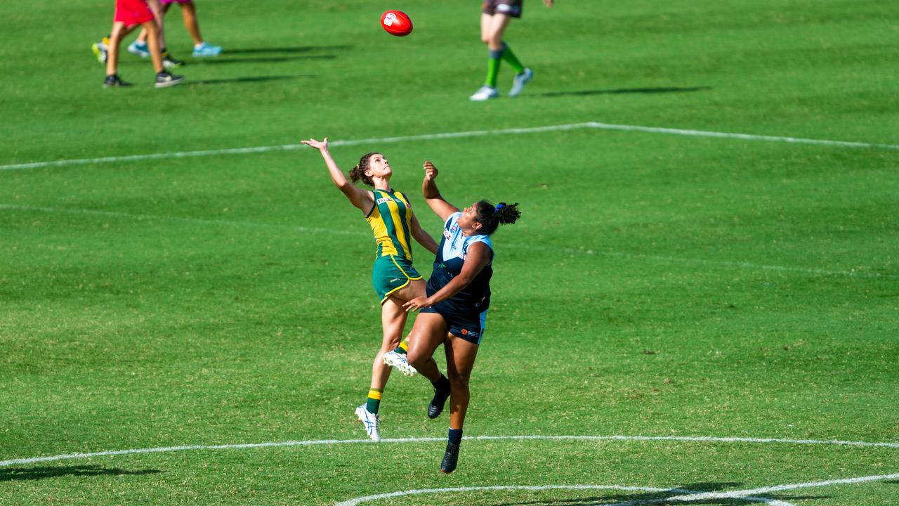 2020-21 NTFL Women's Premier League Grand Final - Darwin Buffettes v PINT Queenants. Jasmyn Hewett and Molly Althouse fight out a centre bounce. Photograph: Che Chorley