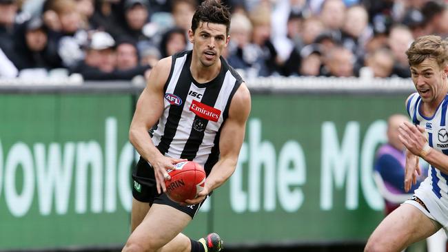 Scott Pendlebury had an interesting run in with a pigeon. Picture: Michael Klein