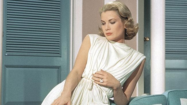 Princess Grace wearing the Cartier diamond engagement ring — over 10 carats and currently in Sydney — given to her by Prince Rainier in 1956.