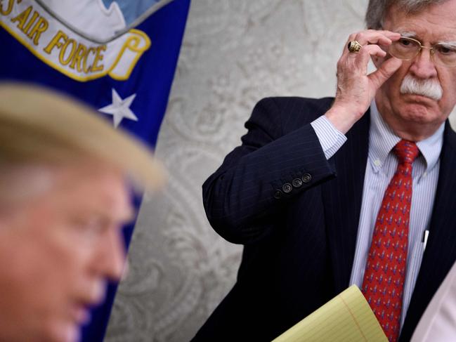 Former National Security Adviser John R. Bolton listens while US President Donald Trump speaks to the press. Picture: AFP