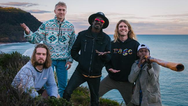 Northern Territory rock band King Stingray, whose self-titled debut album is released in August 2022, pictured at Stanwell Park, NSW while on tour supporting Ball Park Music. L-R: Lewis Stiles (front), Campbell Messer (back), Yirrnga Yunupingu, Roy Kellaway and Dimathaya Burarrwanga. Picture: Sam Brumby