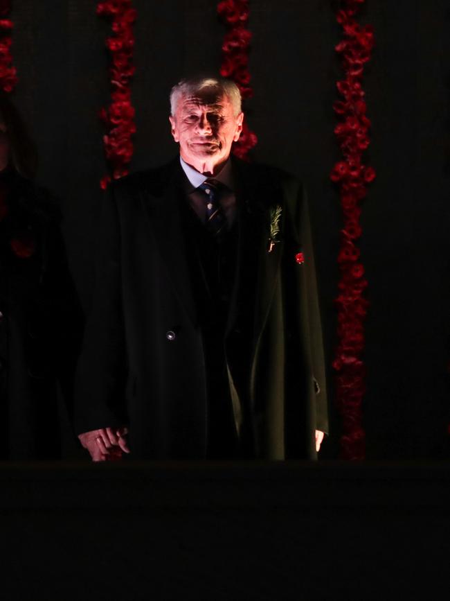 Kerry Stokes stand alongside the Roll of Honour during the Anzac Day commemorative service at the Australian War Memorial in Canberra on Saturday. Picture: AAP