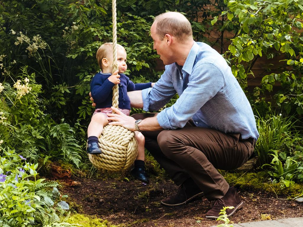 Prince William, Duke of Cambridge and Prince Louis play with a rope swing ahead of the RHS Chelsea Flower Show. Picture: Kensington Palace.