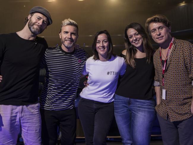 Take That meet fans Angie Redford, left, and Doina Nicutescu. Photo by Michael Wilson, The West Australian.