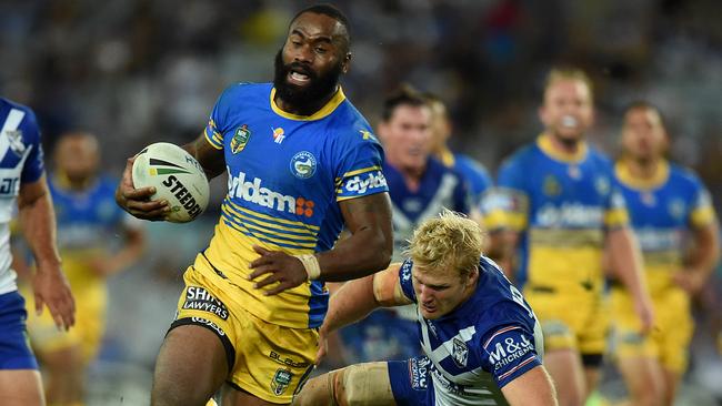 Semi Radradra of the Eels makes a break to score his second try during the round 3 NRL match between the Canterbury-Bankstown Bulldogs and the Parramatta Eels at ANZ Stadium in Sydney, Friday, March 18, 2016. (AAP Image/Dan Himbrechts) NO ARCHIVING, EDITORIAL USE ONLY