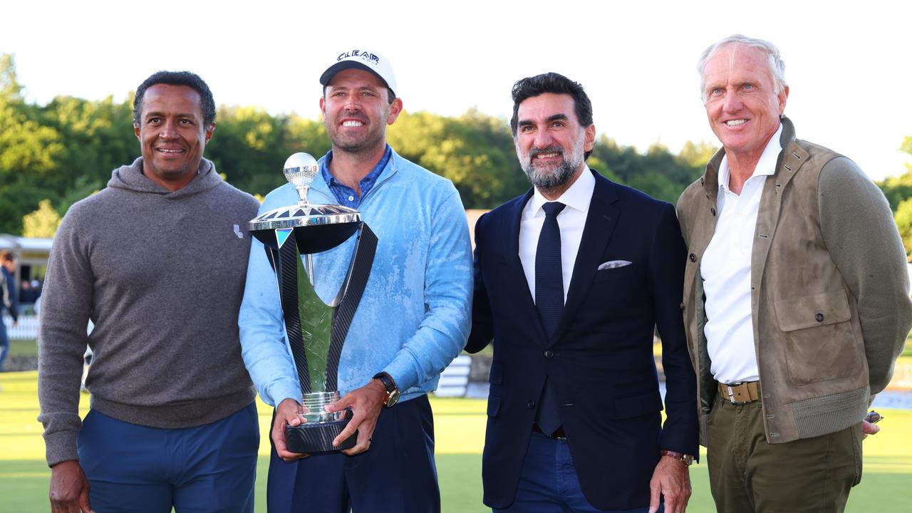 Charl Schwartzel holds his trophy. Photo by Chris Trotman/LIV Golf/Getty Images