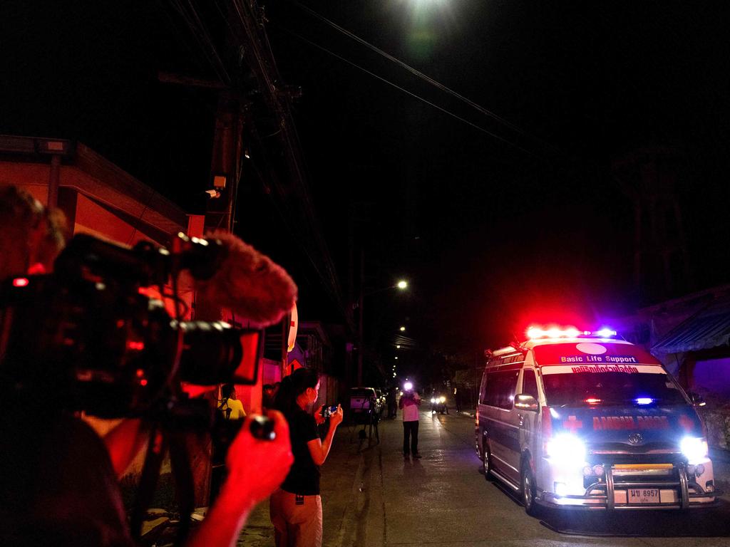 The ambulance carrying the body of Warne leaves Surat Thani Hospital morgue. Picture: AFP