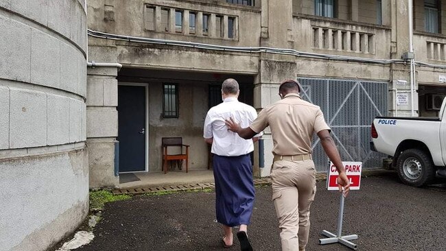 John Nikolic on his way in to court this morning in Suva, where he is appealing his drug smuggling conviction. He was protected by prison guards. Picture: Jessica Gounder