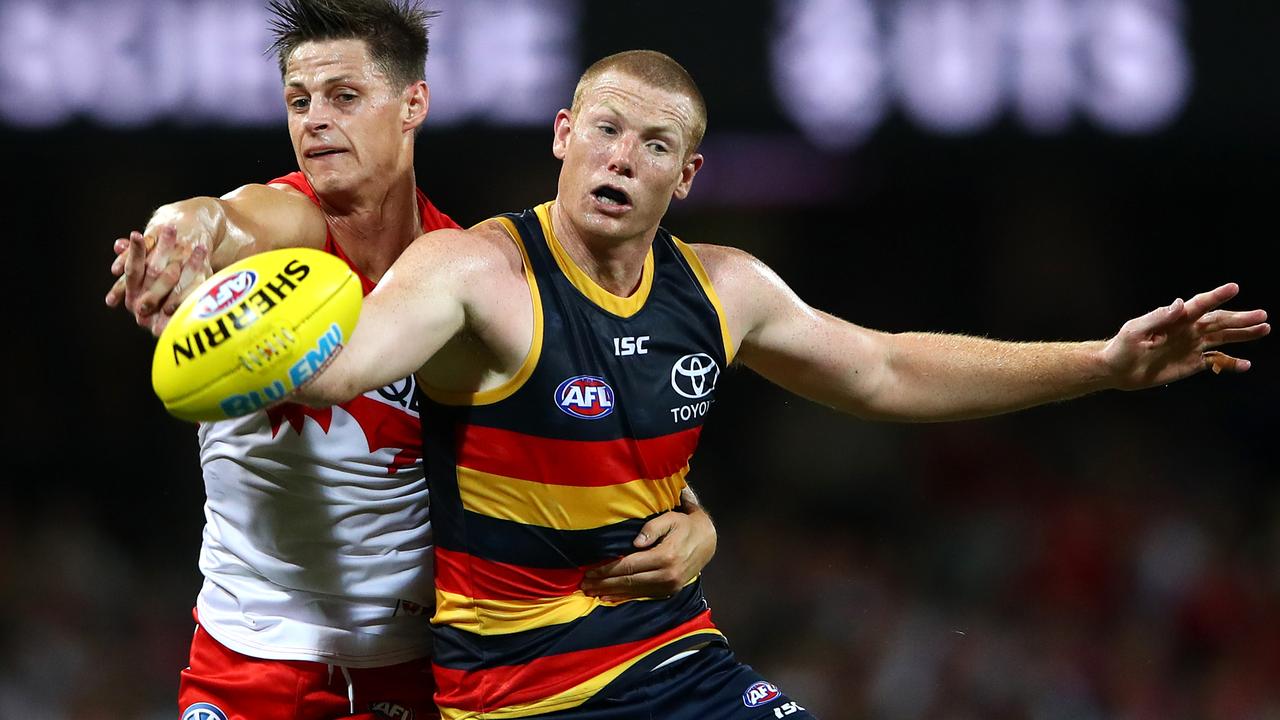 SYDNEY, AUSTRALIA - MARCH 29: Callum Sinclair of the Swans and Sam Jacobs of the Crows contest the ball during the round two AFL match between the Sydney Swans and the Adelaide Crows at Sydney Cricket Ground on March 29, 2019 in Sydney, Australia. (Photo by Cameron Spencer/AFL Media/Getty Images)